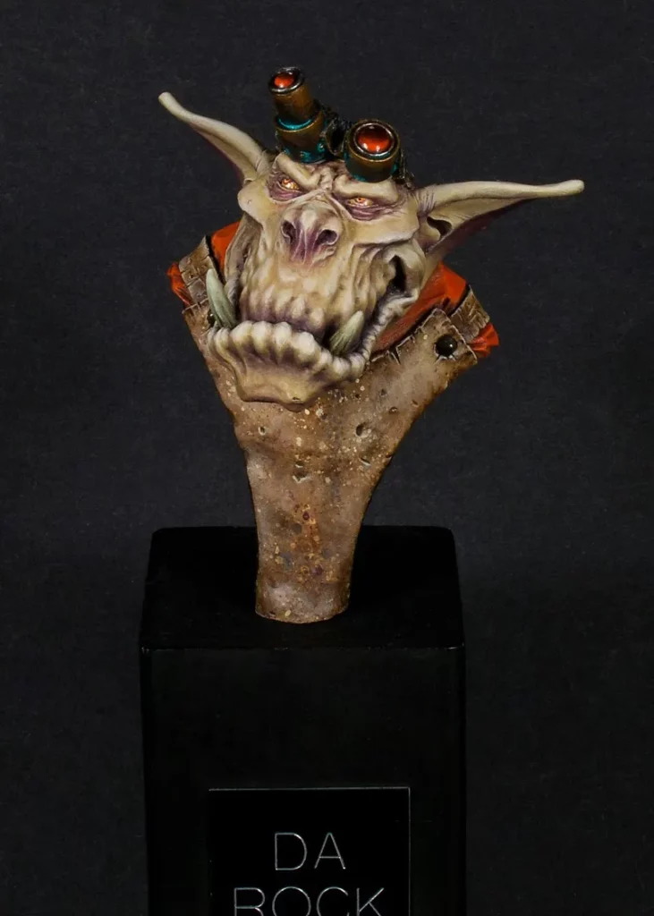 Finished Ein Stein bust - front view focusing on face and apron - miniature painting tutorial by Minichix Studio painting worn-out leather
