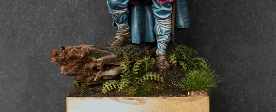 Adding rotten leaves to the scenic base - front view - Minichix Studio tutorial on building miniature bases.