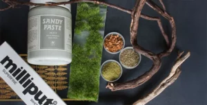 Featured image for Minichix Studio article on building woodland scenic miniature base for Viking Chief - showing materials used in the process.
