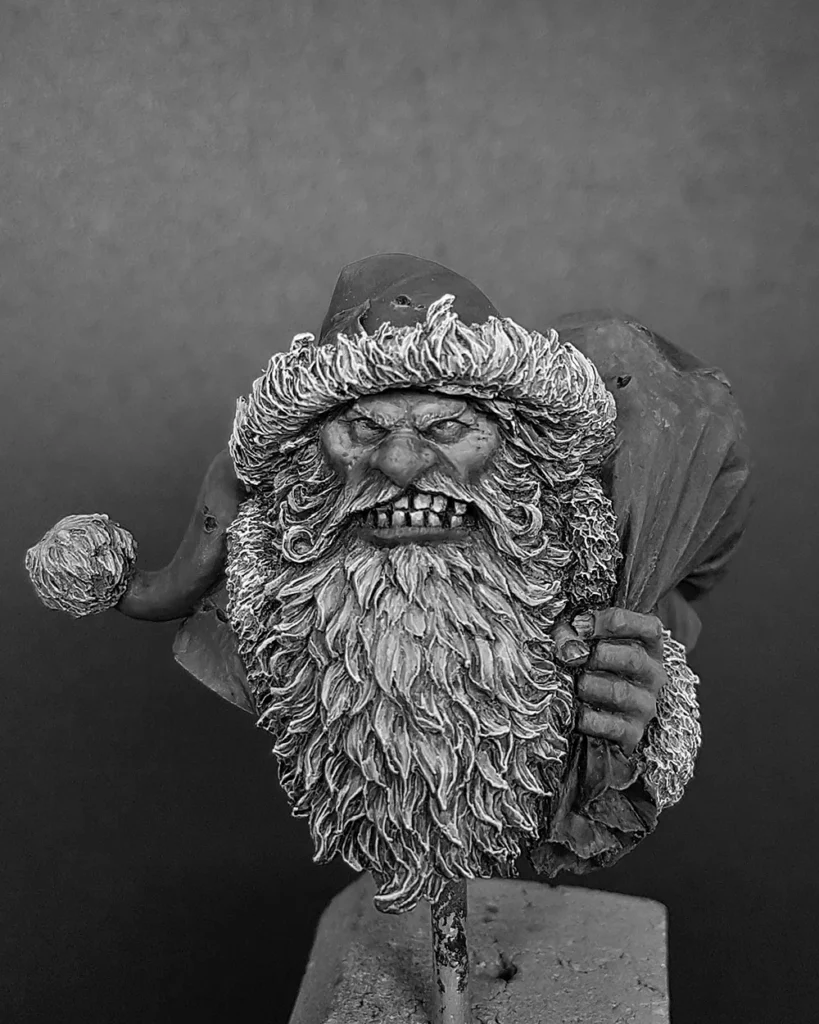 Black and white version of WIP of Bad Santa bust by Latorre featured in Minichix Studio article on checking contrast in miniature painting