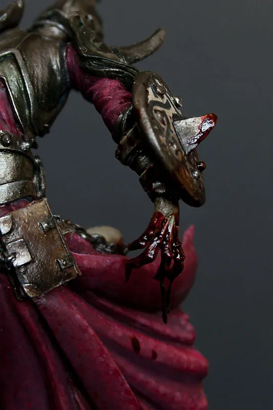 Hand and shield of Menhom by Andrea Miniatures with blood and gore - technical tutorial by Minichix Studio.