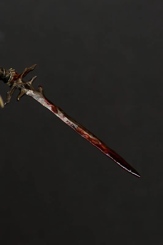 Close-up of sword on Menhom by Andrea Miniatures with added blood - technical tutorial by Minichix Studio.