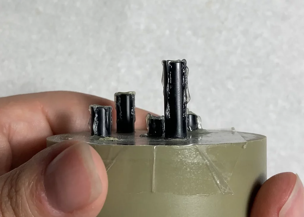 Close-up of candles with dry PVA simulating melting wax - step-by-step scenic base tutorial by Minichix Studio