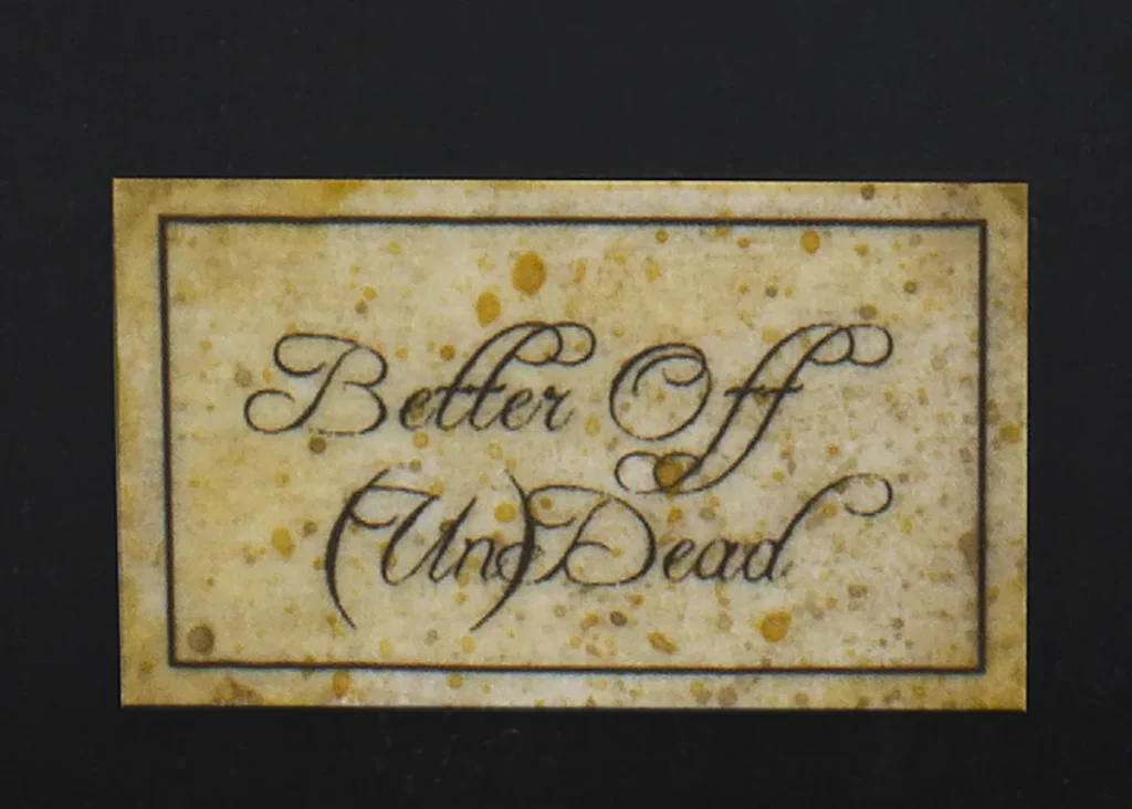 Close-up of finished weathered name plaque - step-by-step miniature painting tutorial by Minichix Studio.