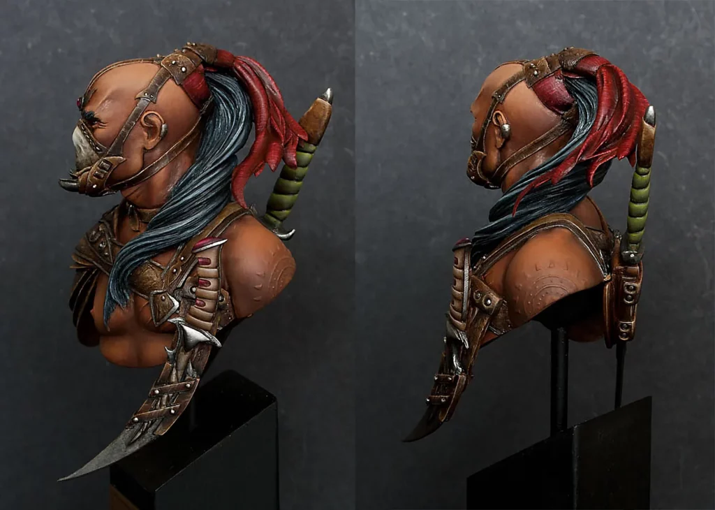Picture of a 2 angles of a finished painting on the Grinder bust with added scars and scarifications used in the article by Minichix Studio about sculpting scars on miniatures.